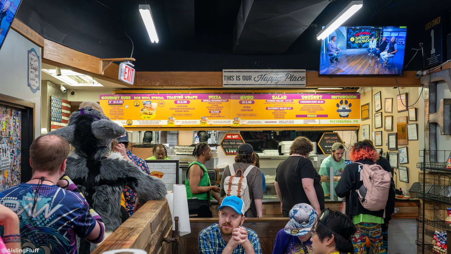 Anthrocon attendees lining up for food at a partnered restaurant.
